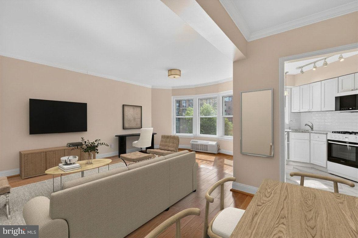 2500 Q Street Northwest, Unit 227 Washington, DC 20007 - Photo 3 of 13 a living room with furniture and a flat screen tv