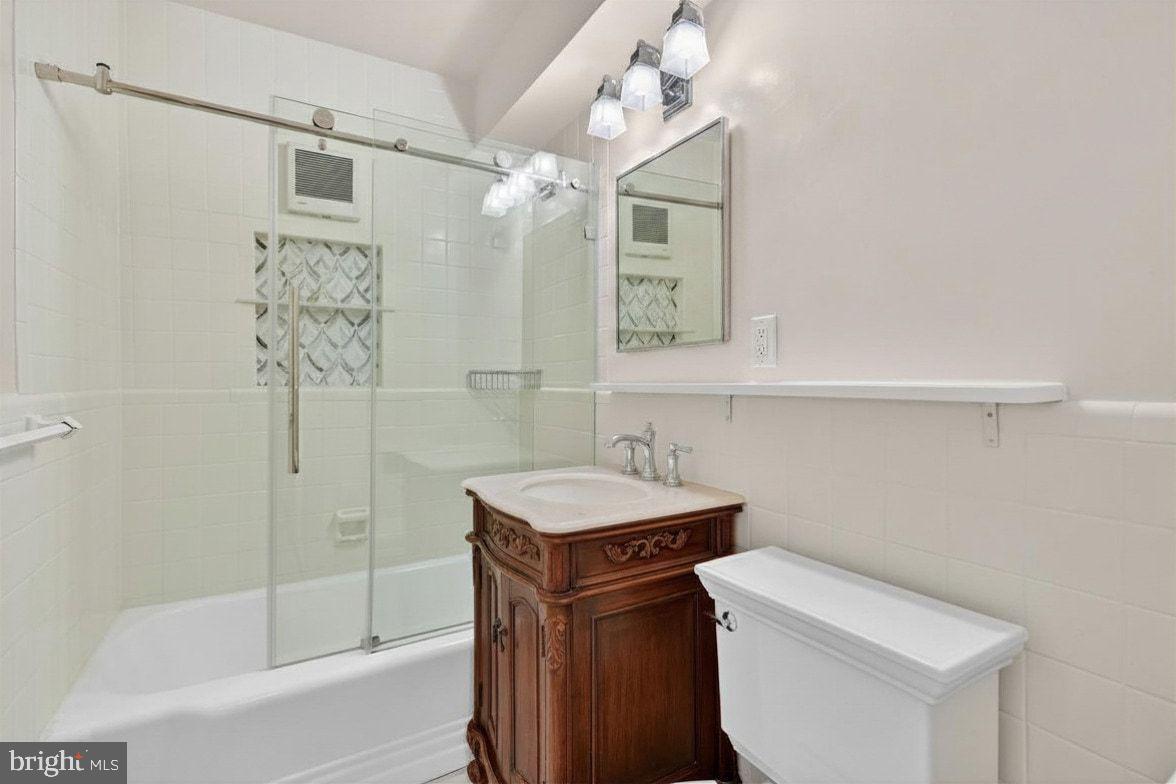 2500 Q Street Northwest, Unit 227 Washington, DC 20007 - Photo 6 of 13 a bathroom with a sink a toilet and shower