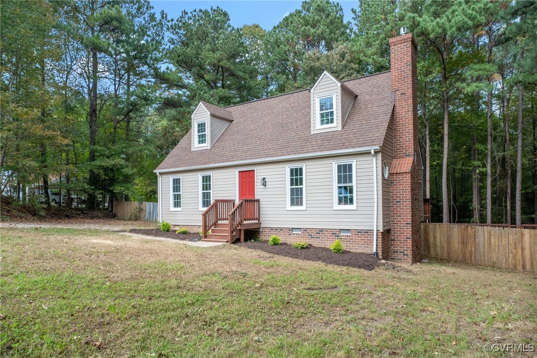 7201 Courthouse Road Chesterfield, VA 23832 - Photo 5 of 41 a front view of a house with a yard and trees