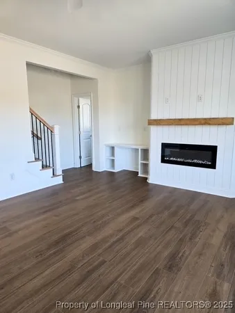 a spacious bathroom with double sink and two mirror
