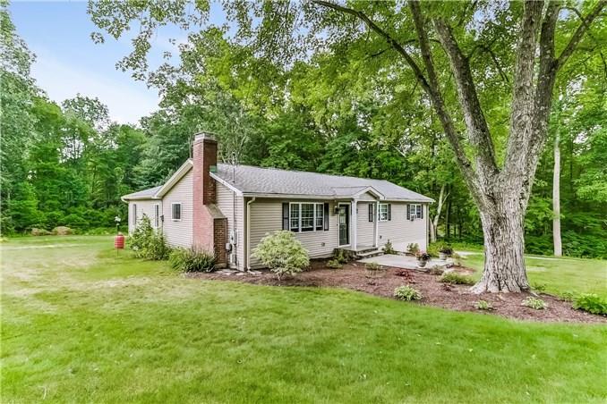 15 Quarry Ridge Road Monroe, CT 06468 - Photo 1 of 1 a backyard of a house with table and chairs