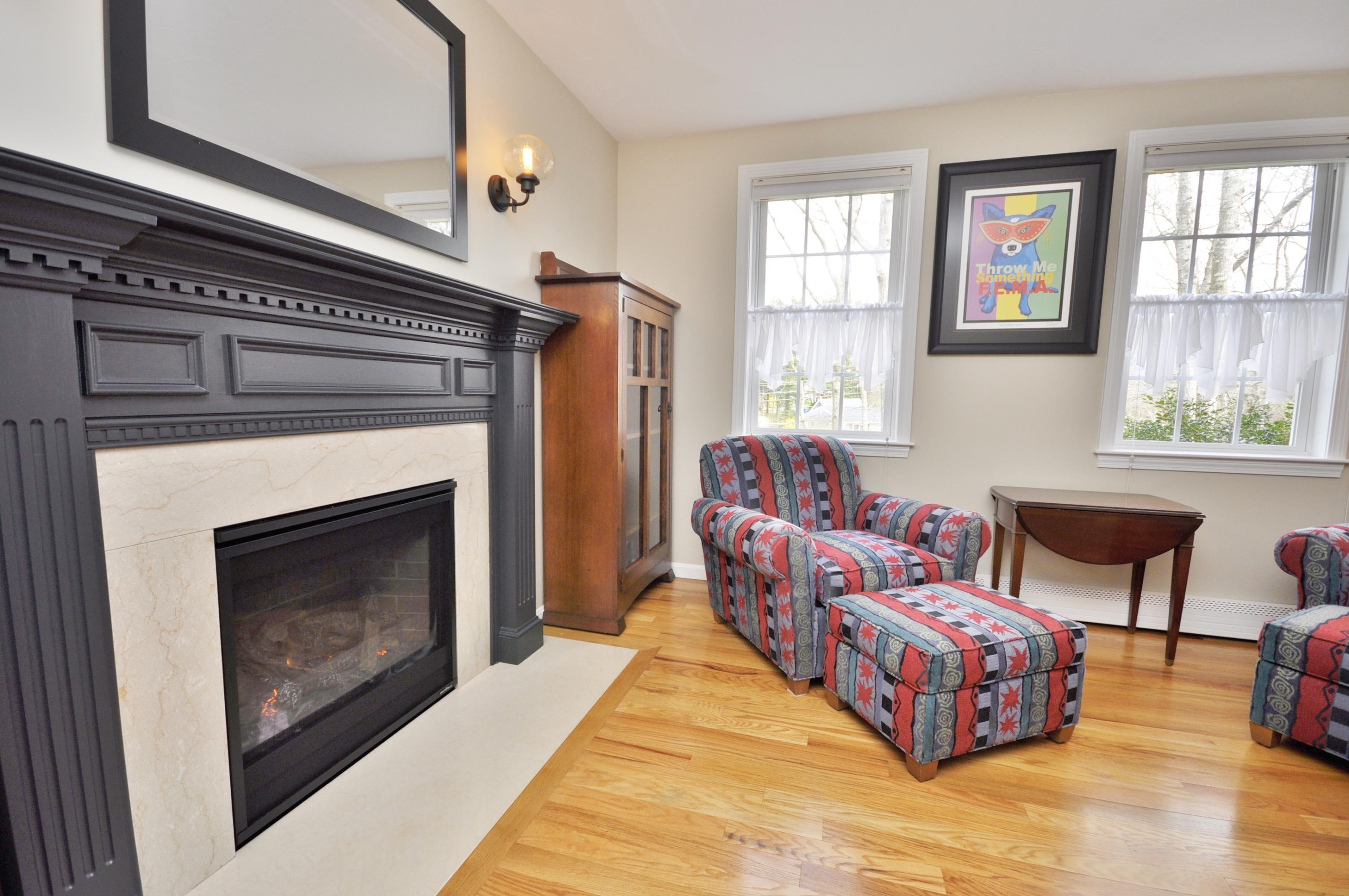 2 Crowell Road Sagamore Beach, MA 02562 - Photo 14 of 27 a living room with furniture fireplace and window