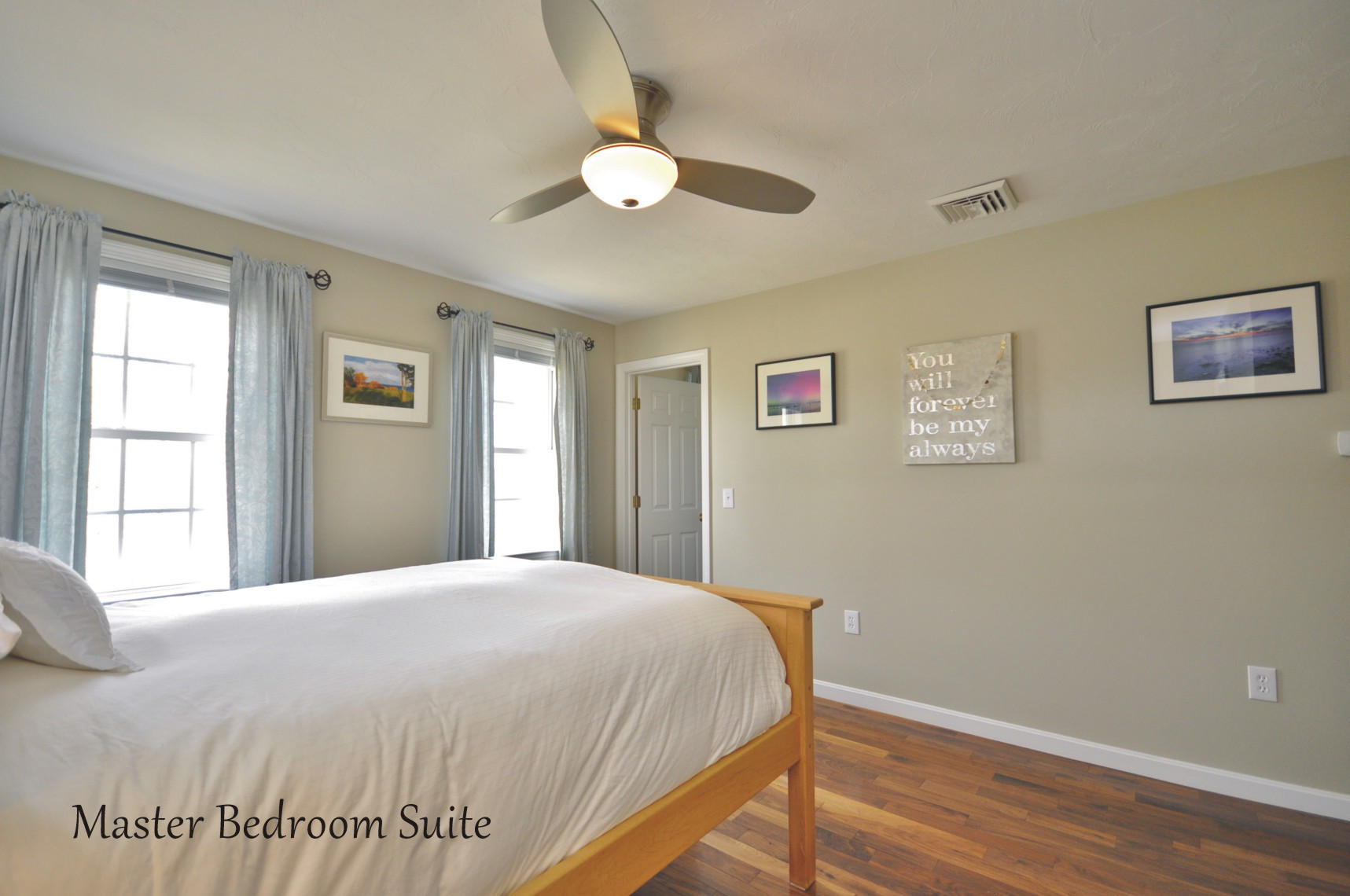 2 Crowell Road Sagamore Beach, MA 02562 - Photo 15 of 27 a bedroom with a large bed and a window