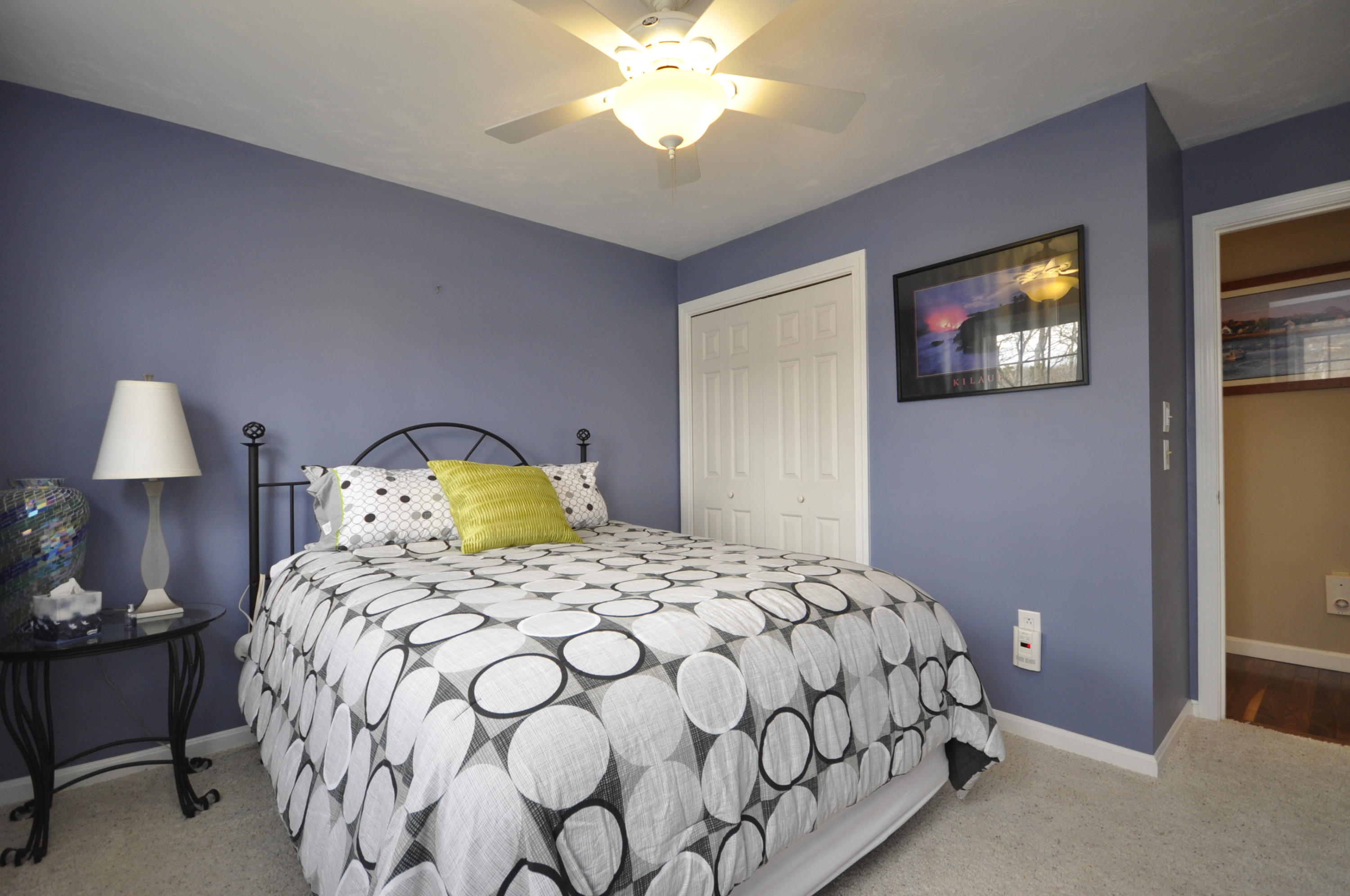 2 Crowell Road Sagamore Beach, MA 02562 - Photo 20 of 27 a bedroom with a bed and a lamp with the potted plant