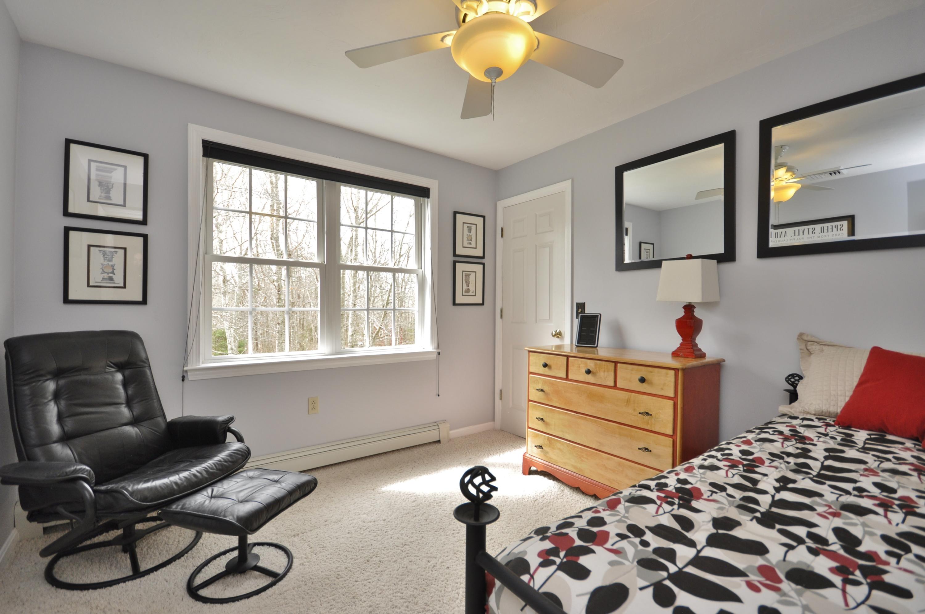 2 Crowell Road Sagamore Beach, MA 02562 - Photo 21 of 27 a bedroom with a bed and wooden floor