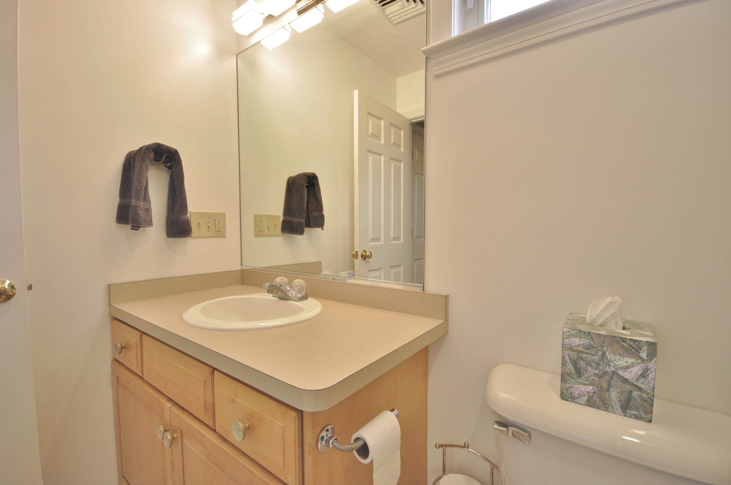 2 Crowell Road Sagamore Beach, MA 02562 - Photo 23 of 27 a bathroom with a sink and a mirror