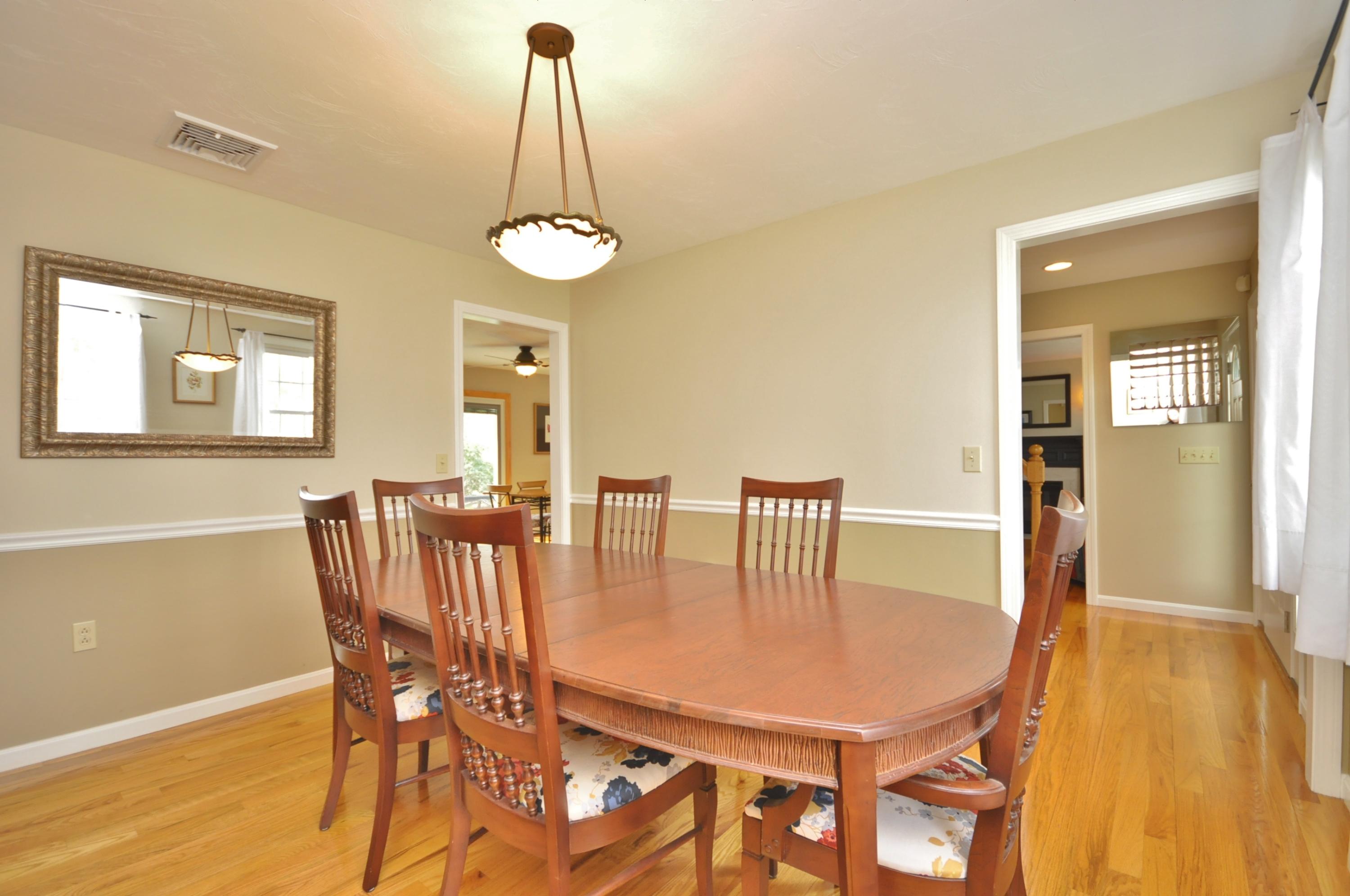 2 Crowell Road Sagamore Beach, MA 02562 - Photo 10 of 27 a view of a dining room with furniture and wooden floor