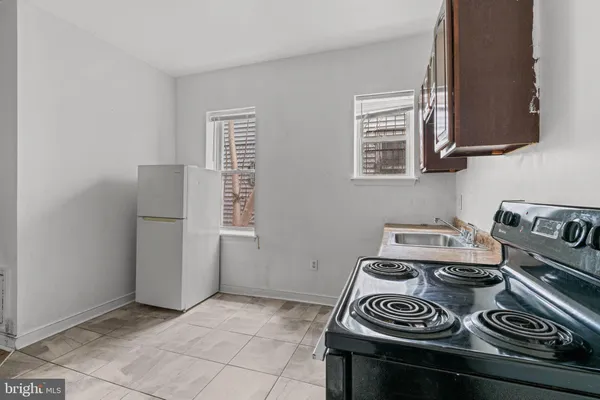 a kitchen with a stove and a cabinet