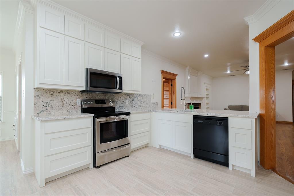 364 Parker Road Van Alstyne, TX 75495 - Photo 15 of 40 New kitchen cabinets, counters, floors and appliances.