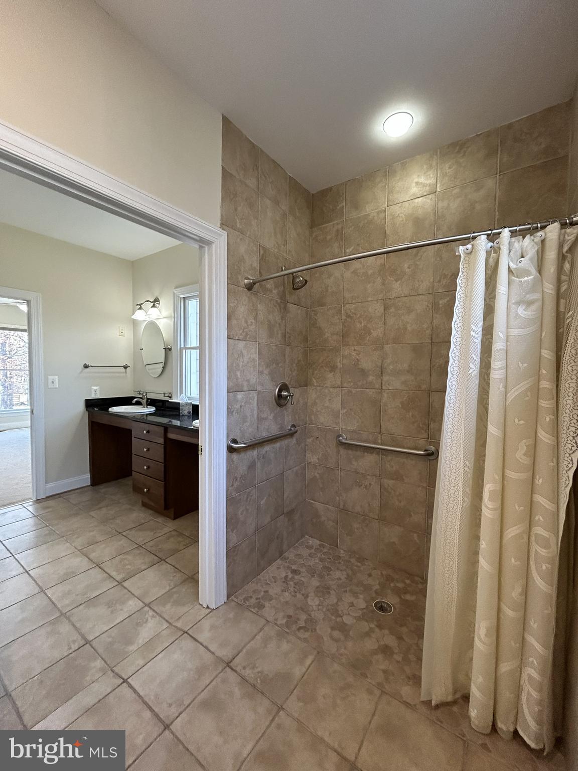 37218 Bolyn Road Purcellville, VA 20132 - Photo 17 of 62 a bathroom with a sink and a mirror
