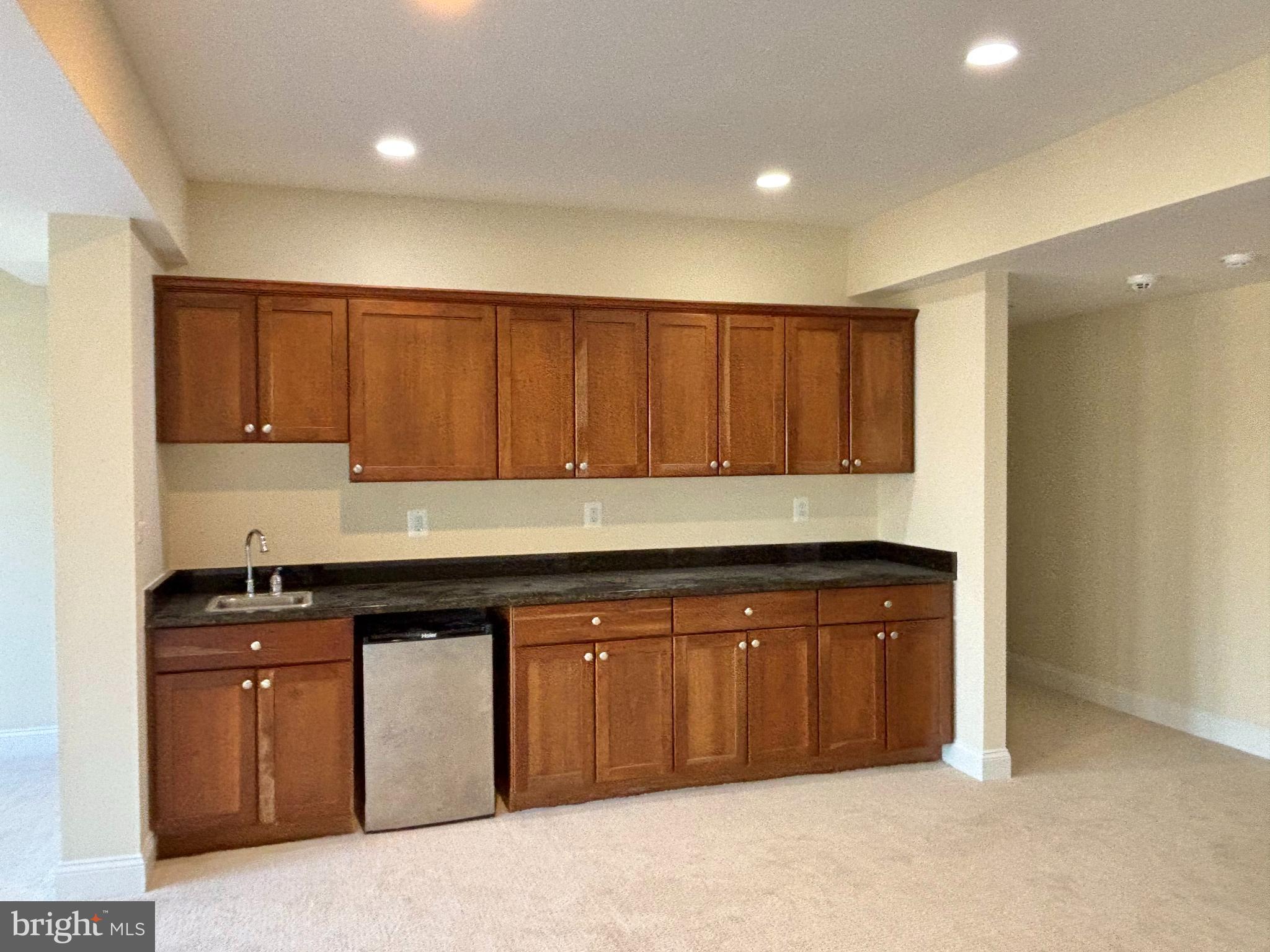 37218 Bolyn Road Purcellville, VA 20132 - Photo 18 of 62 a kitchen with granite countertop a sink and cabinets