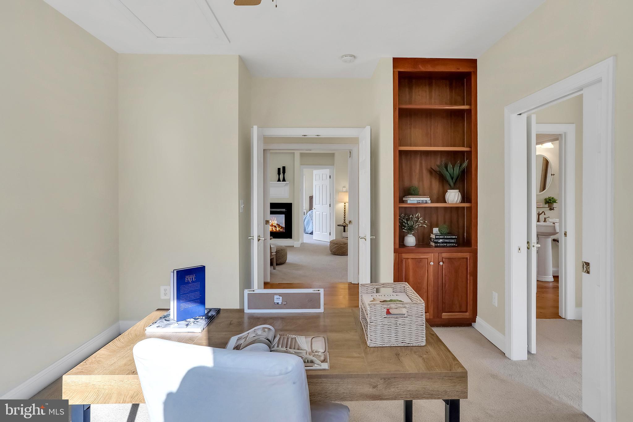 37218 Bolyn Road Purcellville, VA 20132 - Photo 34 of 62 a living room with furniture and a book shelf