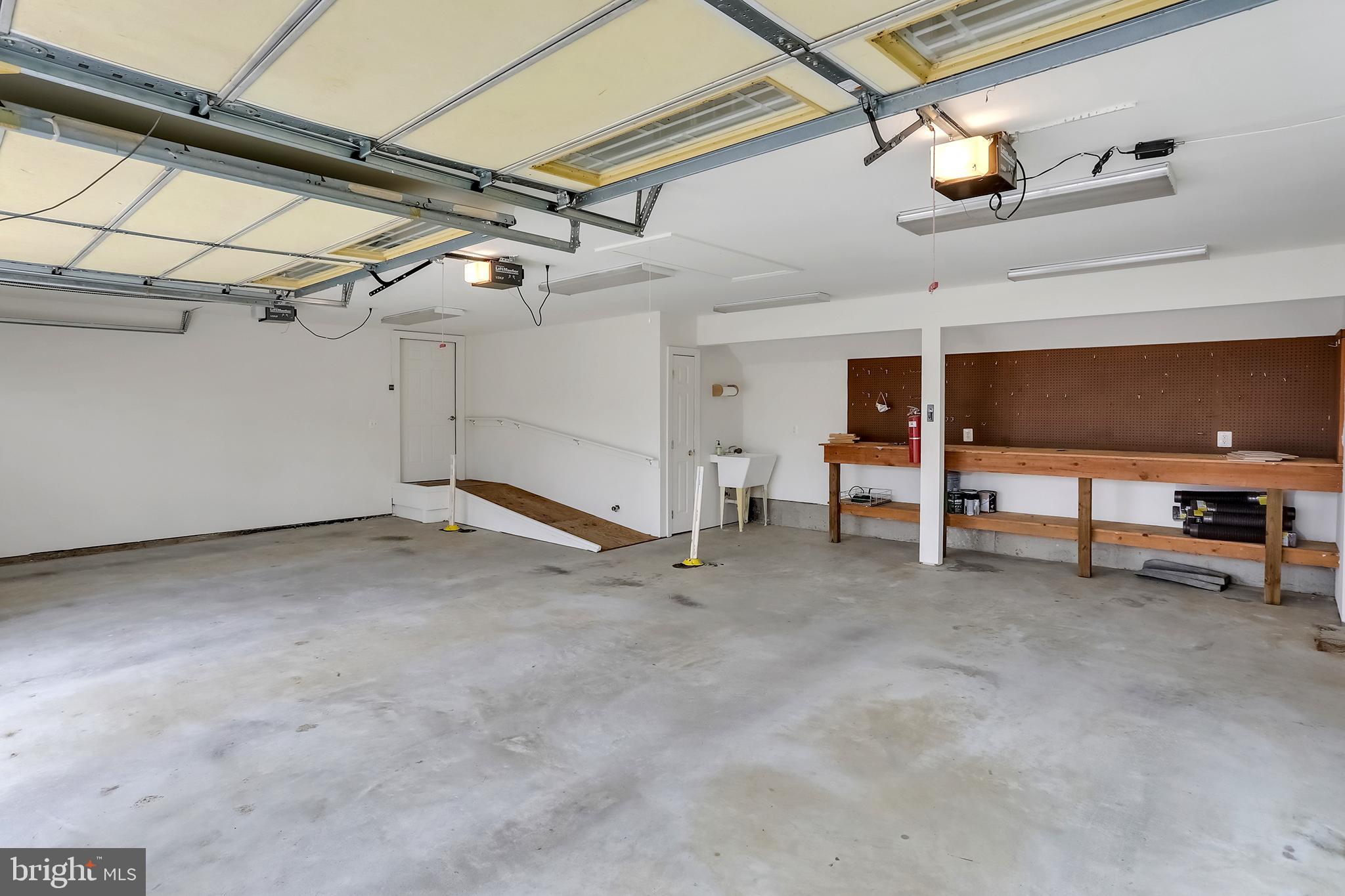 37218 Bolyn Road Purcellville, VA 20132 - Photo 41 of 62 3 Car garage with ADA ramp built in workbench