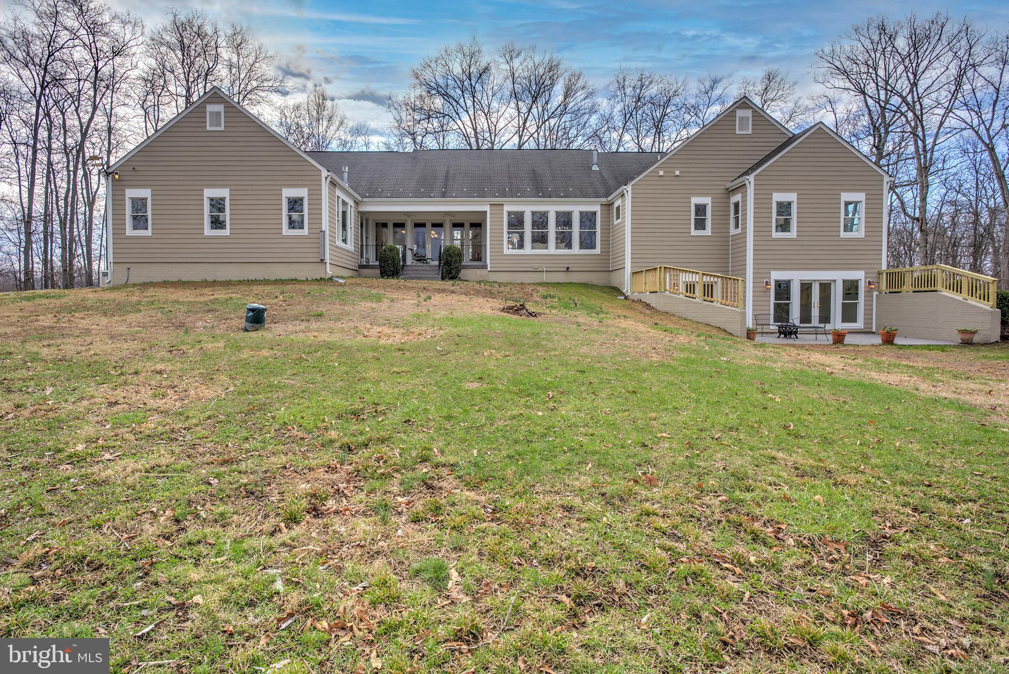 37218 Bolyn Road Purcellville, VA 20132 - Photo 9 of 62 a front view of a house with a garden and yard