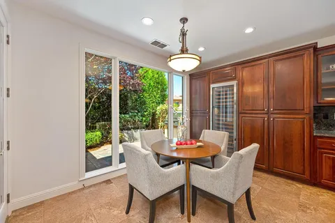 a view of a dining room with furniture wooden floor and chandelier