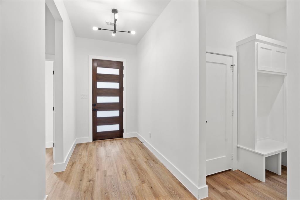 2227 Fordham Road Dallas, TX 75216 - Photo 15 of 30 wooden floor in an empty room with a window