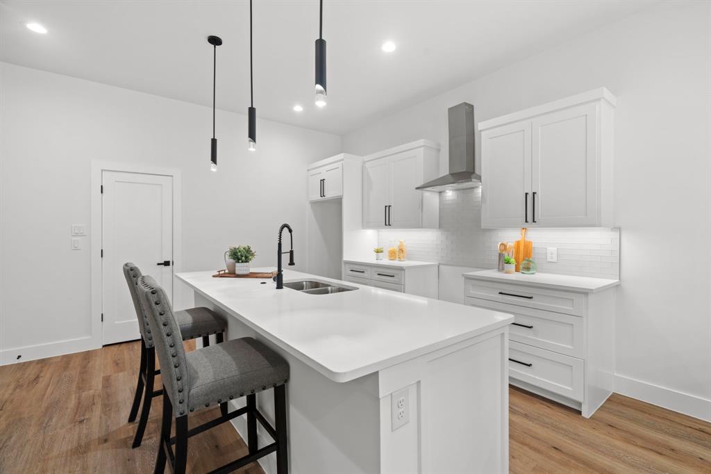 2227 Fordham Road Dallas, TX 75216 - Photo 6 of 30 a kitchen with a table chairs refrigerator and microwave