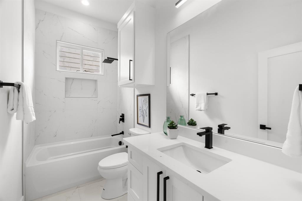 2227 Fordham Road Dallas, TX 75216 - Photo 10 of 30 a bathroom with a sink a toilet and shower