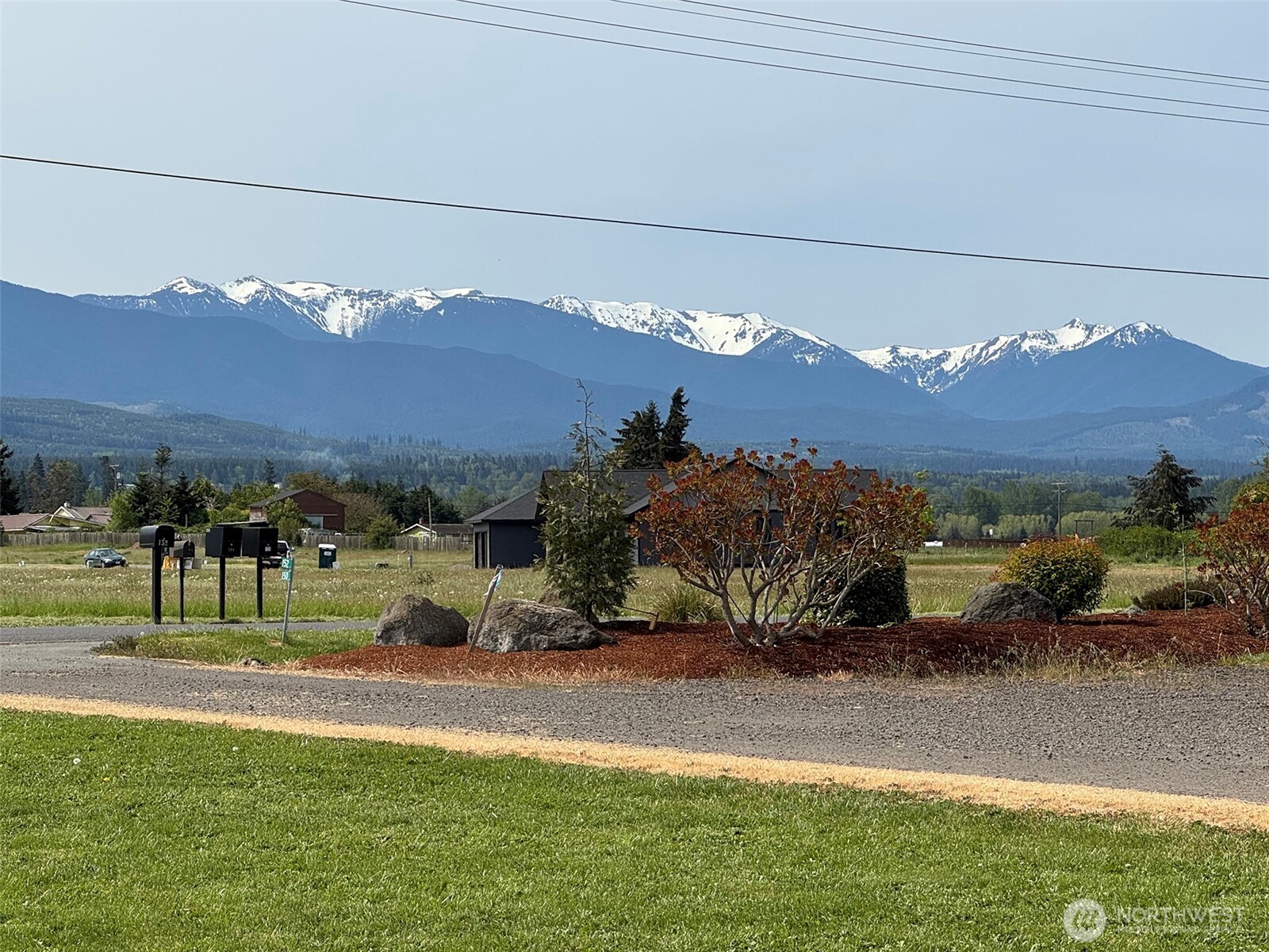 152 Macleay Road Sequim, WA 98382 - Photo 7 of 40 a view of a street with a mountain
