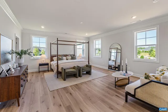 a bedroom with a bed and a couch