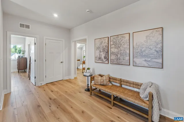 a view of room with window and wooden floor