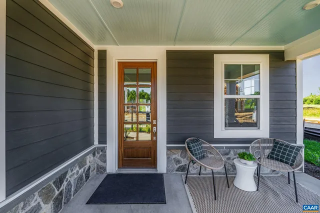 a view of a chair and table in the balcony