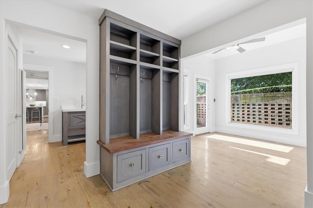 4310 Forest Bend Road Dallas, TX 75244 - Photo 22 of 40 Built-in mudroom storage featuring bench seating, storage compartments, and coat hooks