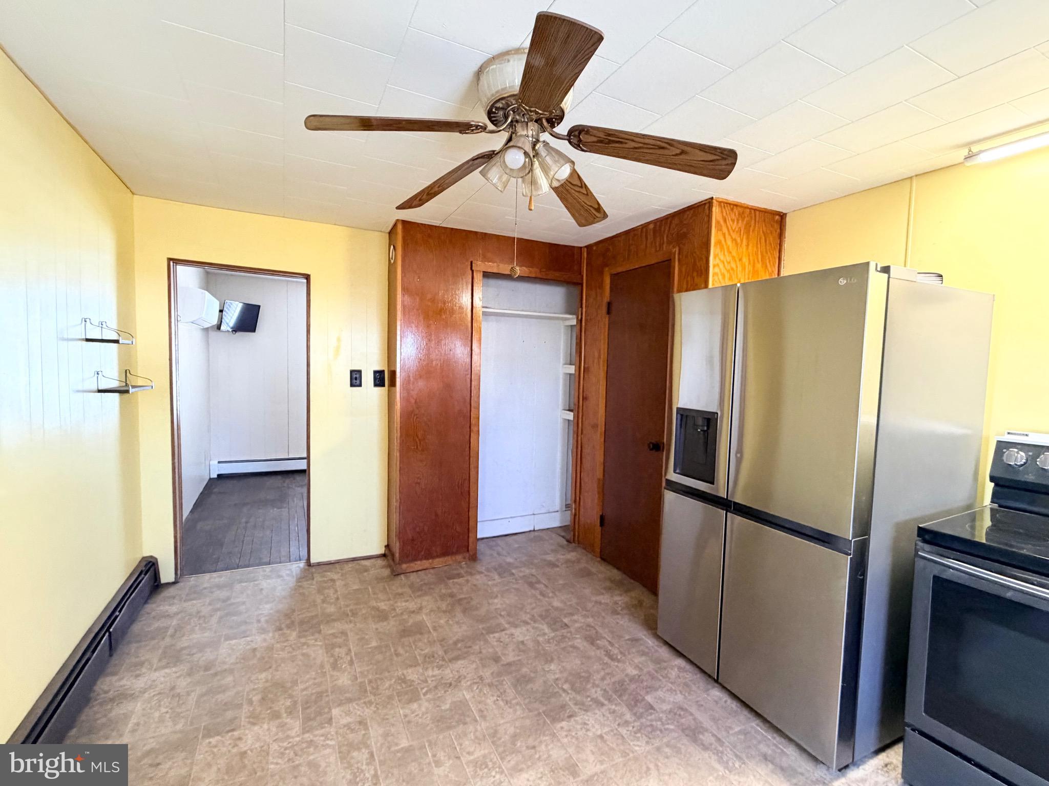 181 West Mechanic Street Frostburg, MD 21532 - Photo 11 of 36 a view of a kitchen with a refrigerator and a sink