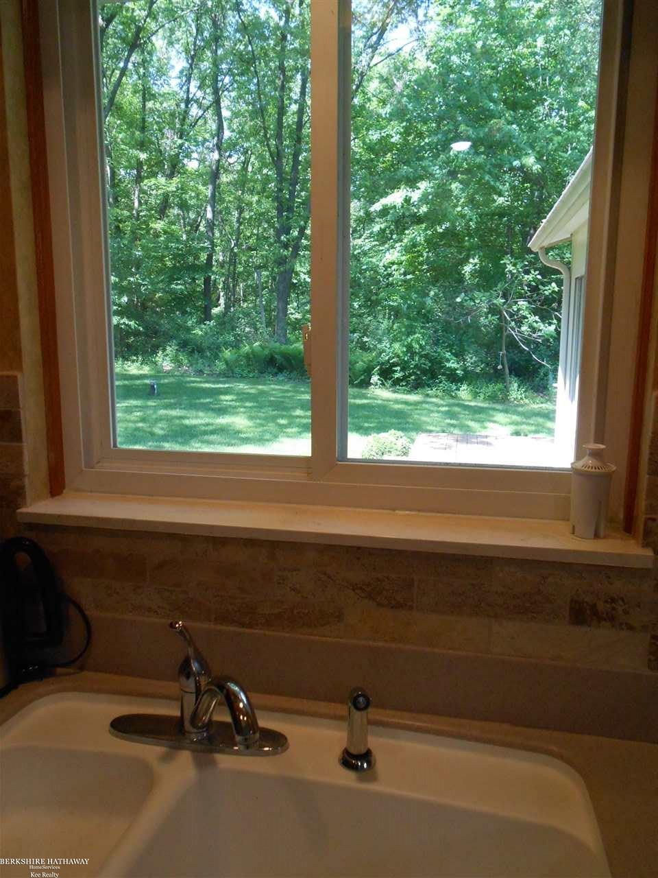 3393 East Sutton Road Dryden, MI 48428 - Photo 15 of 32 Kitchen Sink View of Outd