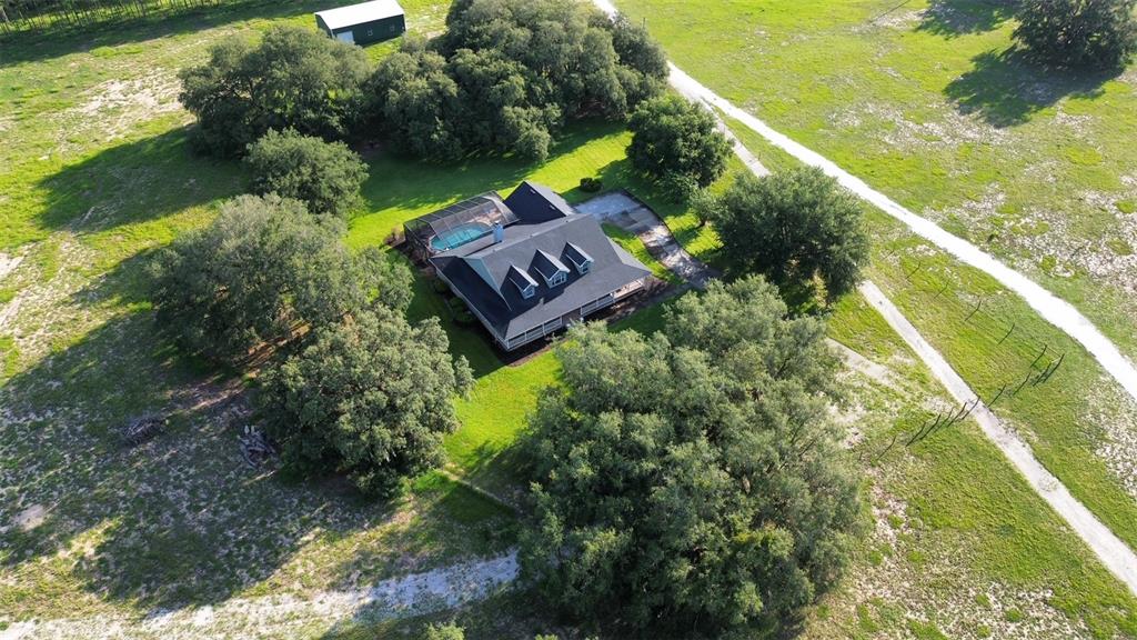 9045 Lake Hatchineha Road Kissimmee, FL 34759 - Photo 47 of 47 a aerial view of a house with a yard and lake view