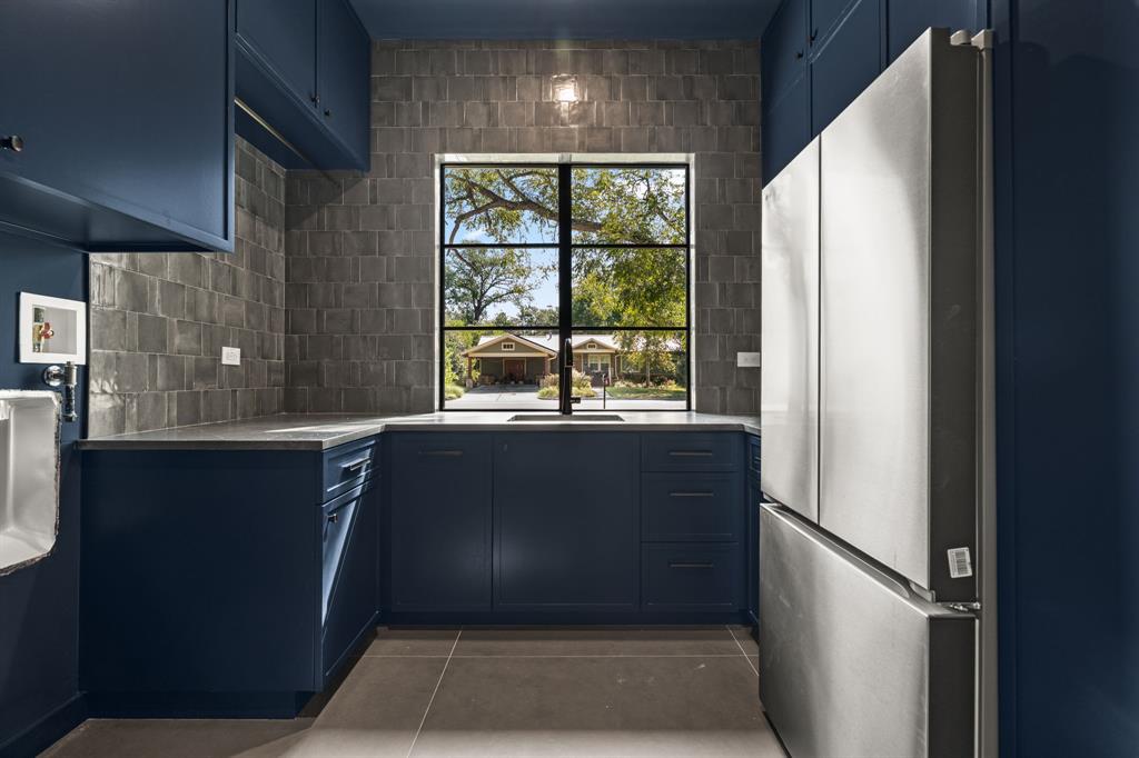 5908 Bull Creek Road Austin, TX 78757 - Photo 32 of 36 Laundry room is located on the main floor and includes a second fridge and tons of storage.