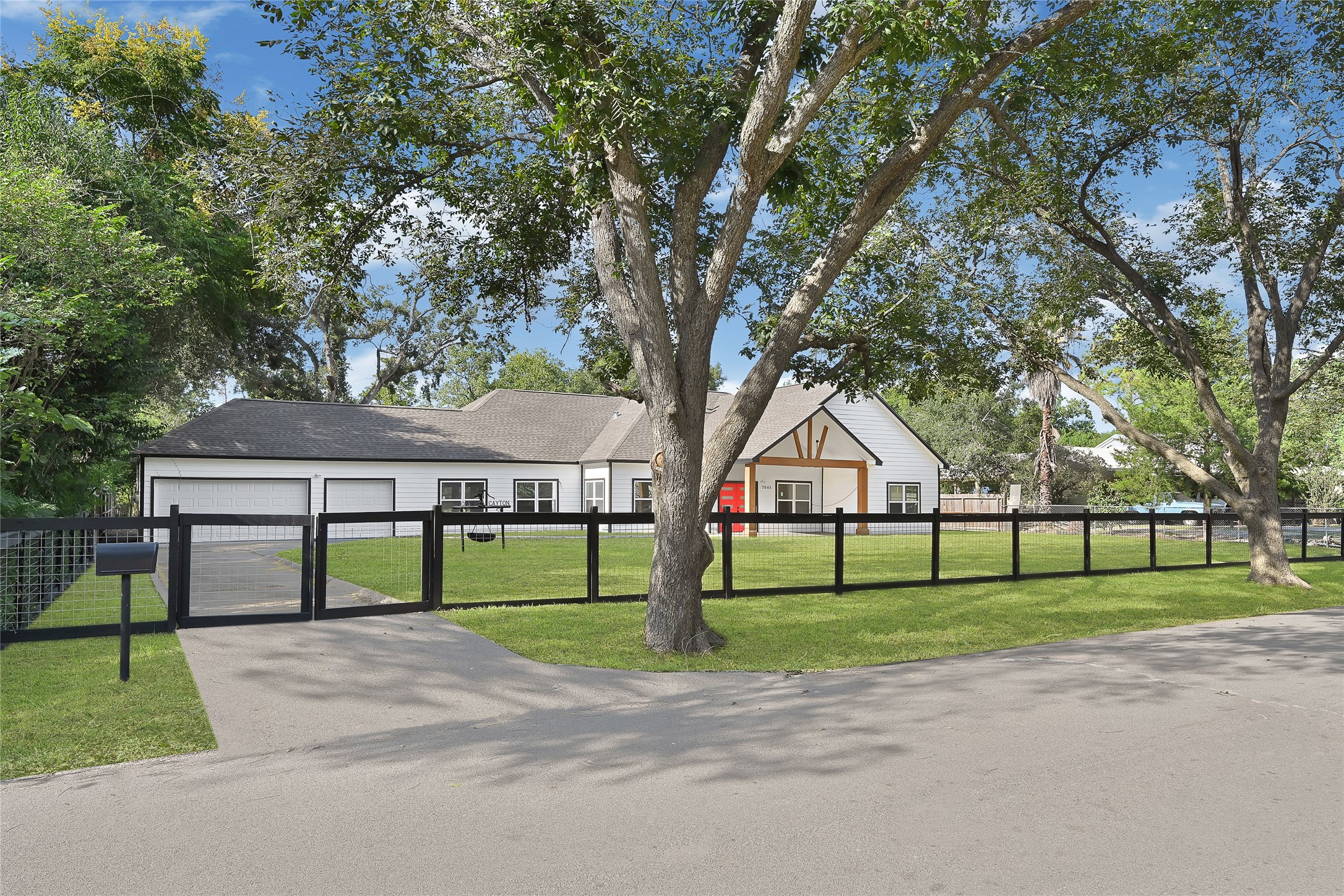 7045 Cayton Street Houston, TX 77061 - Photo 1 of 37 a view of road and trees in the background