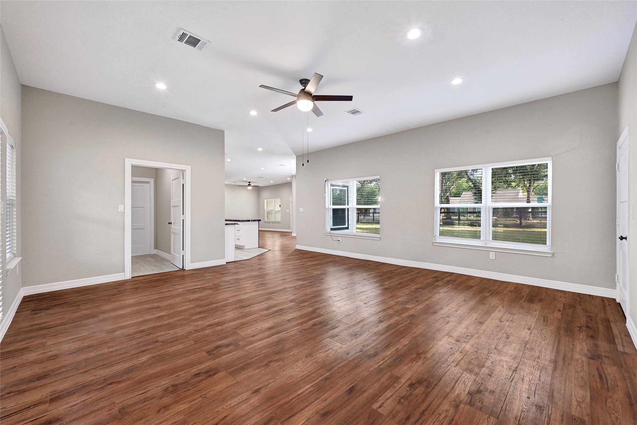 7045 Cayton Street Houston, TX 77061 - Photo 14 of 37 a view of empty room with wooden floor and fan