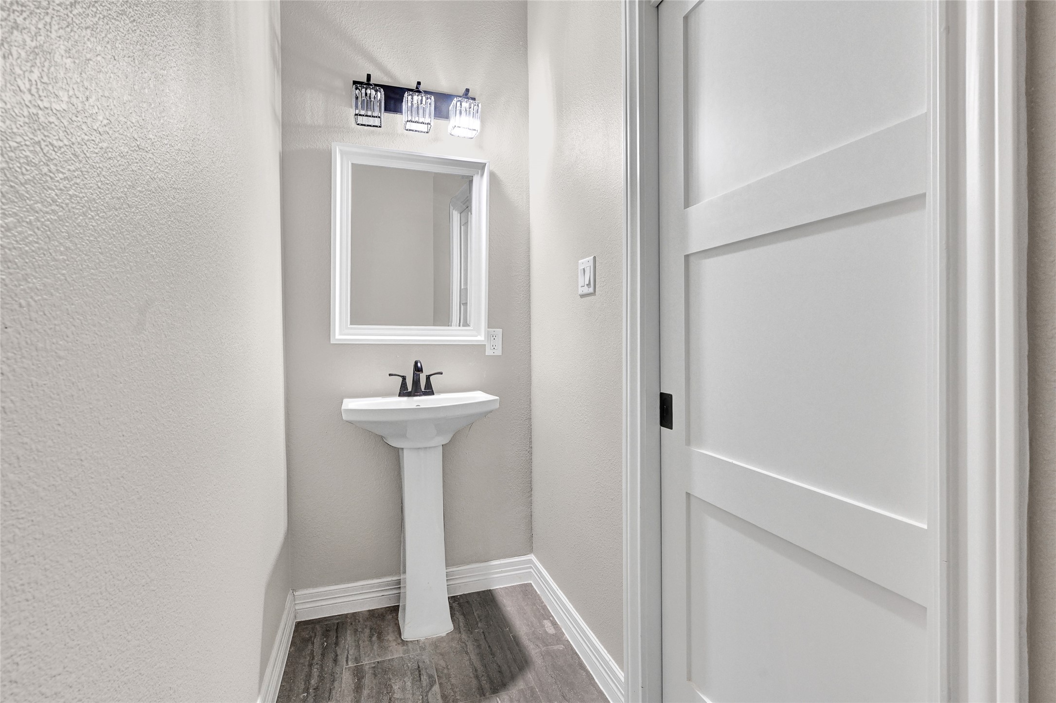 7045 Cayton Street Houston, TX 77061 - Photo 15 of 37 a bathroom with a sink a mirror and a toilet