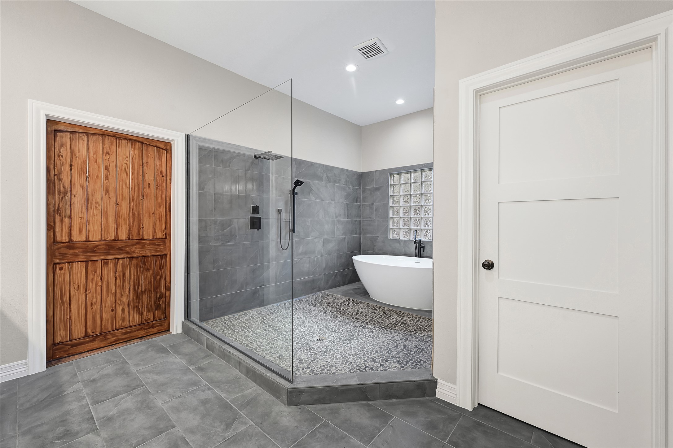 7045 Cayton Street Houston, TX 77061 - Photo 20 of 37 a bathroom with a granite countertop shower a sink and a mirror