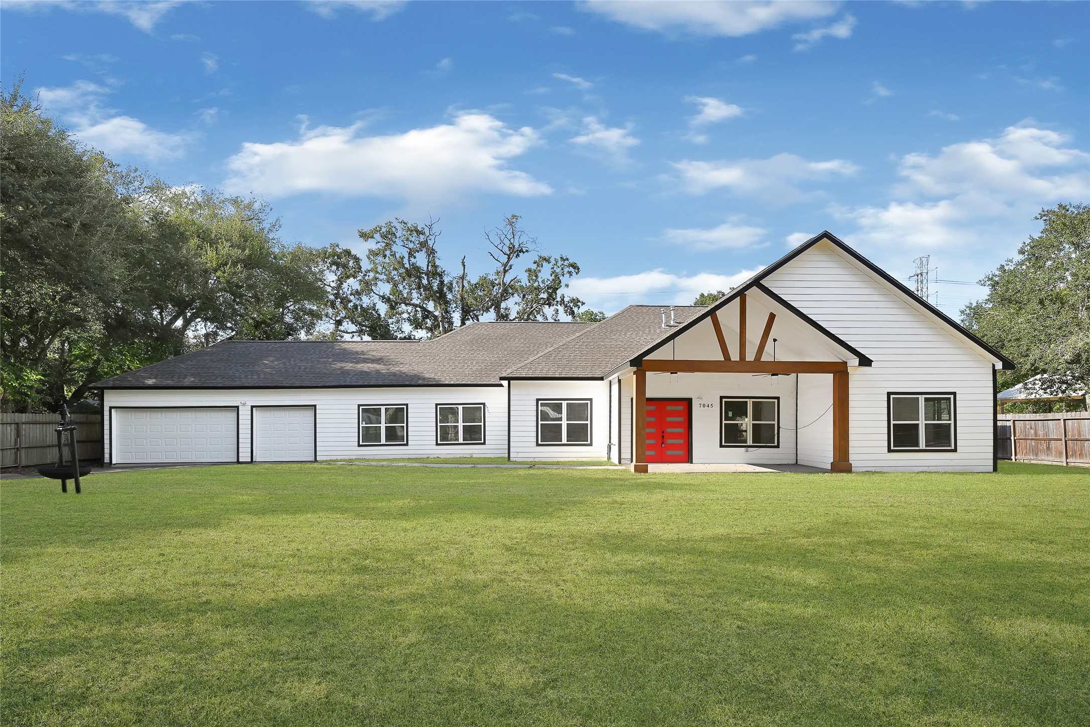 7045 Cayton Street Houston, TX 77061 - Photo 2 of 37 a view of a house with a yard and potted plants