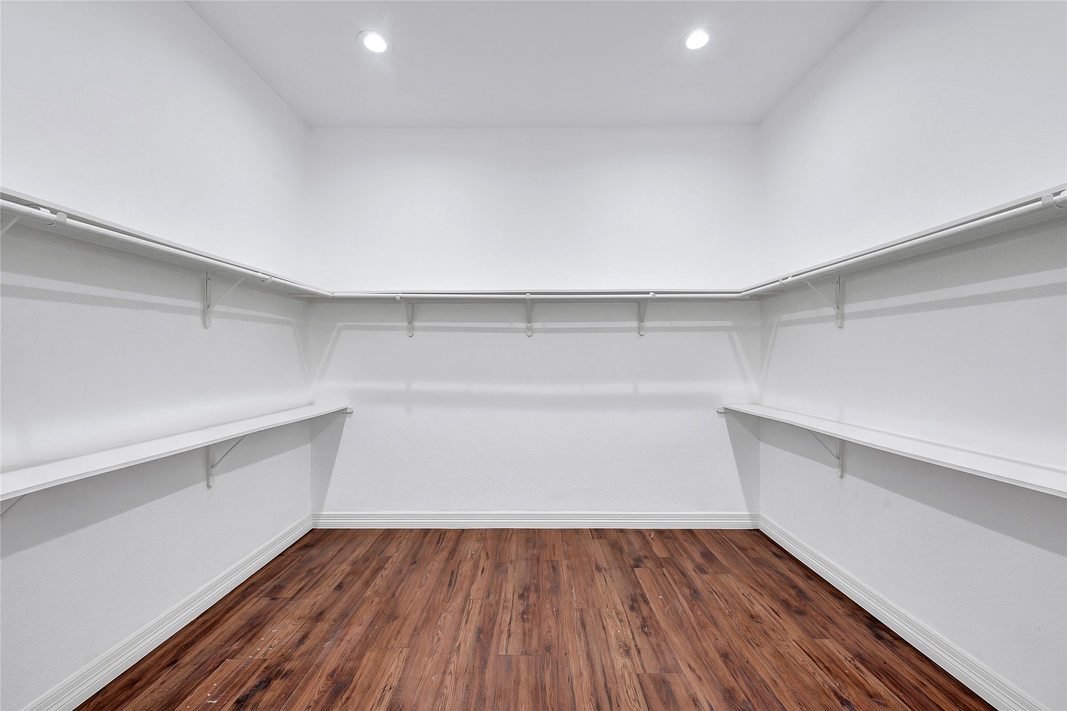 7045 Cayton Street Houston, TX 77061 - Photo 23 of 37 a view of storage and utility room with wooden floor