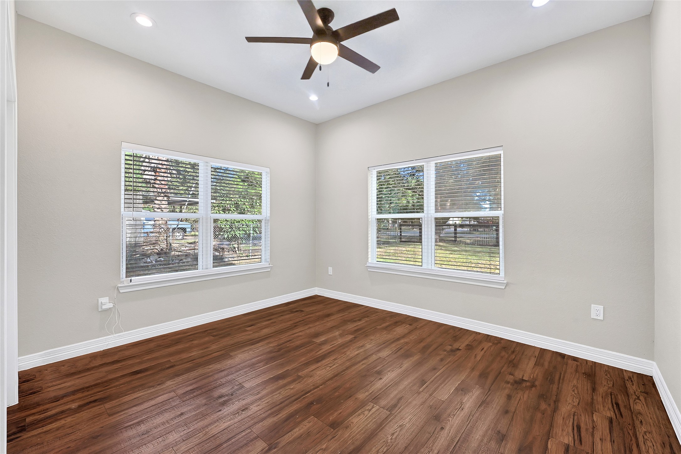 7045 Cayton Street Houston, TX 77061 - Photo 25 of 37 a view of an empty room with wooden floor and a window