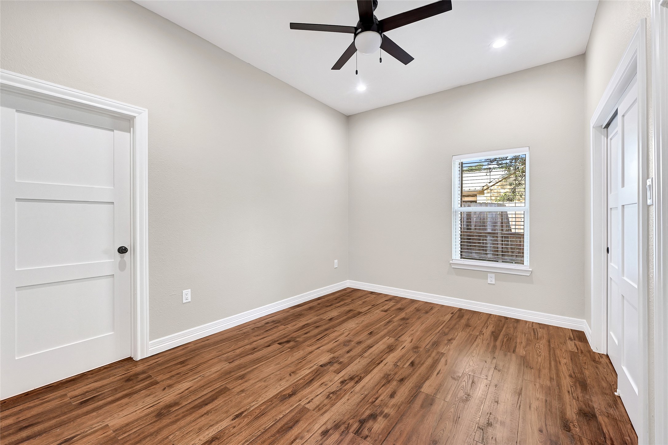 7045 Cayton Street Houston, TX 77061 - Photo 27 of 37 wooden floor in an empty room with a window