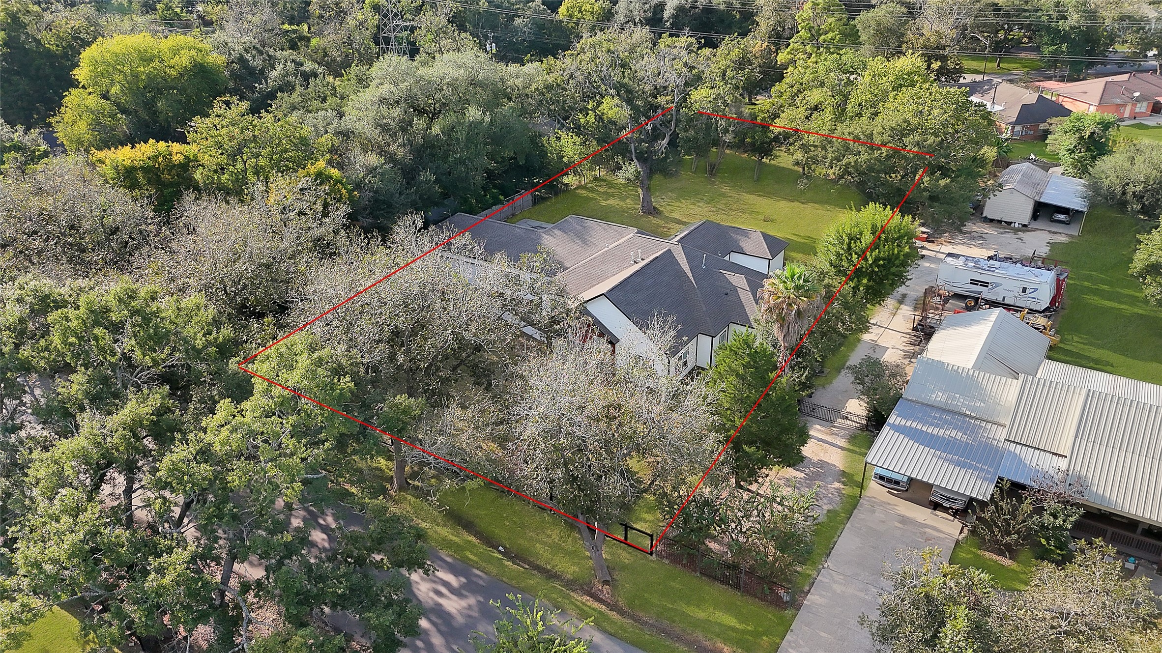 7045 Cayton Street Houston, TX 77061 - Photo 34 of 37 an aerial view of a house with a yard and lake view