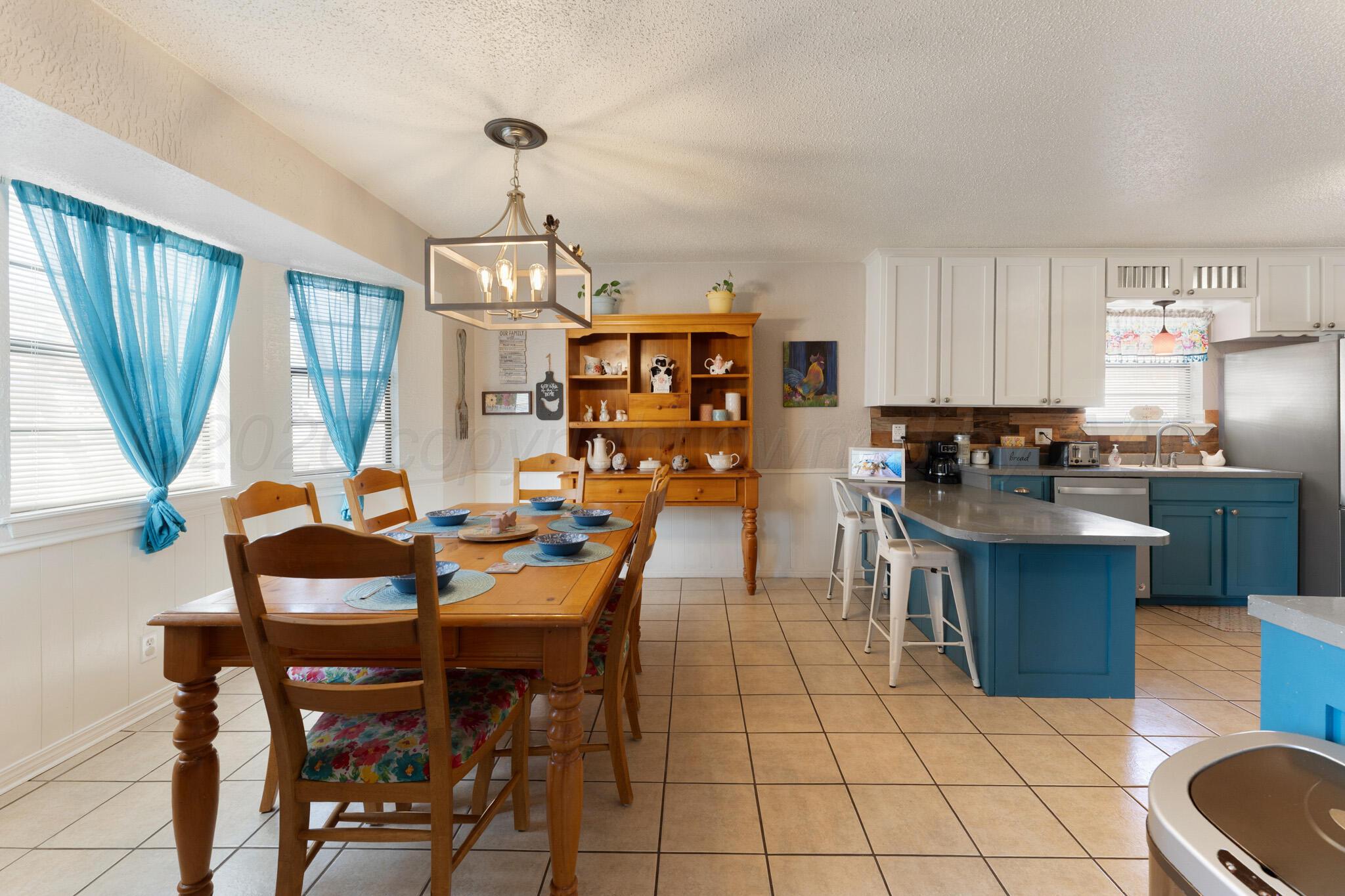 6114 Cornell Street Amarillo, TX 79109 - Photo 12 of 33 a view of a dining room with furniture window and outside view