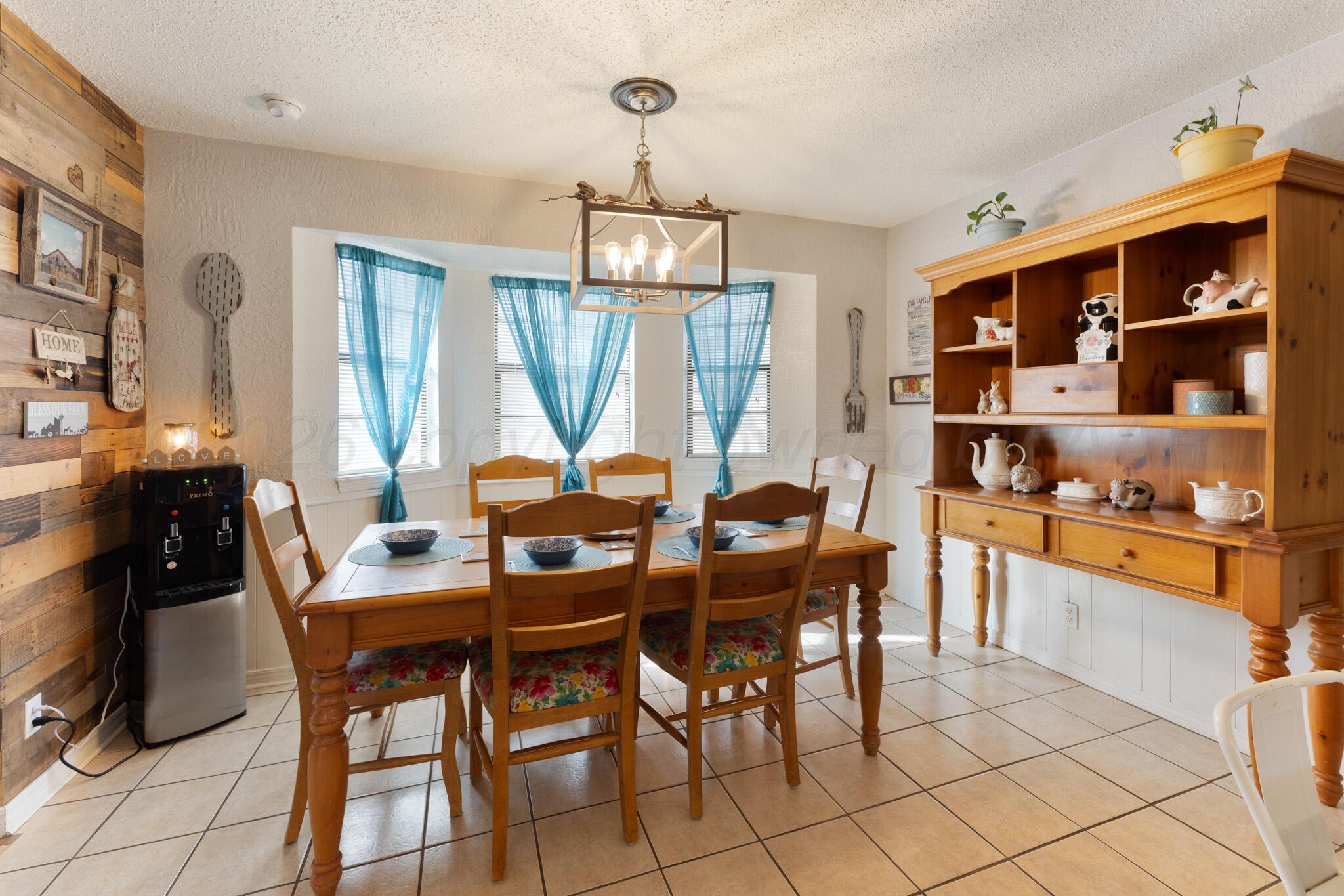 6114 Cornell Street Amarillo, TX 79109 - Photo 13 of 33 a view of a dining room with furniture window and outside view