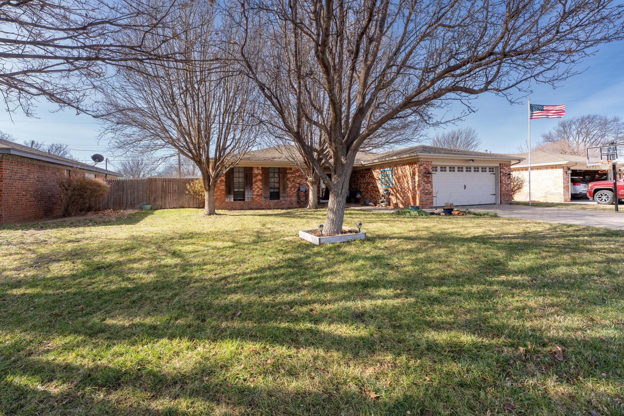 6114 Cornell Street Amarillo, TX 79109 - Photo 2 of 33 a view of a house with a yard