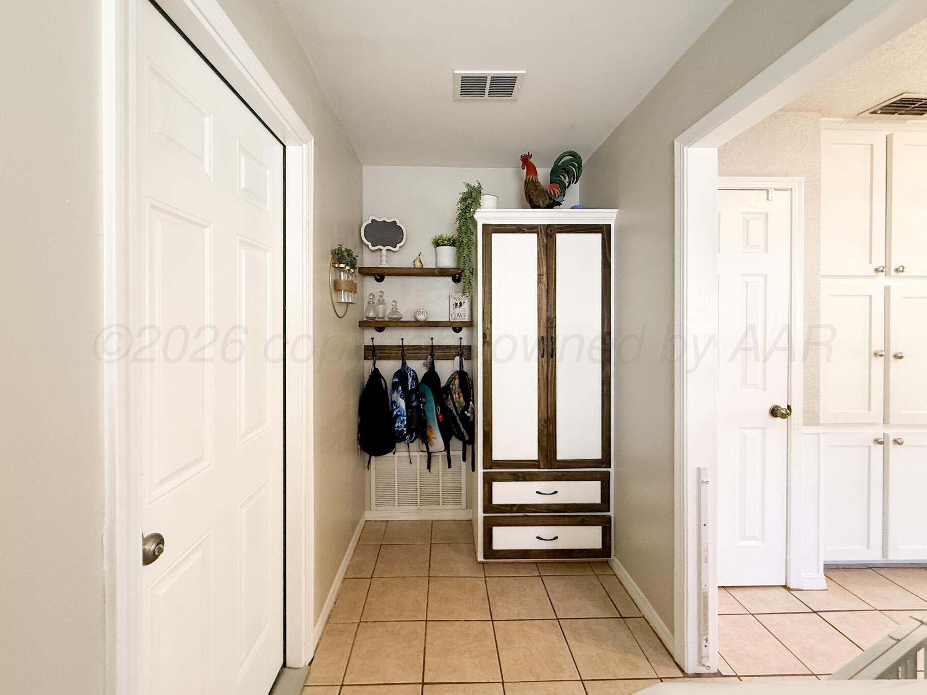 6114 Cornell Street Amarillo, TX 79109 - Photo 29 of 33 a view of walk in closet with clothes and shoes