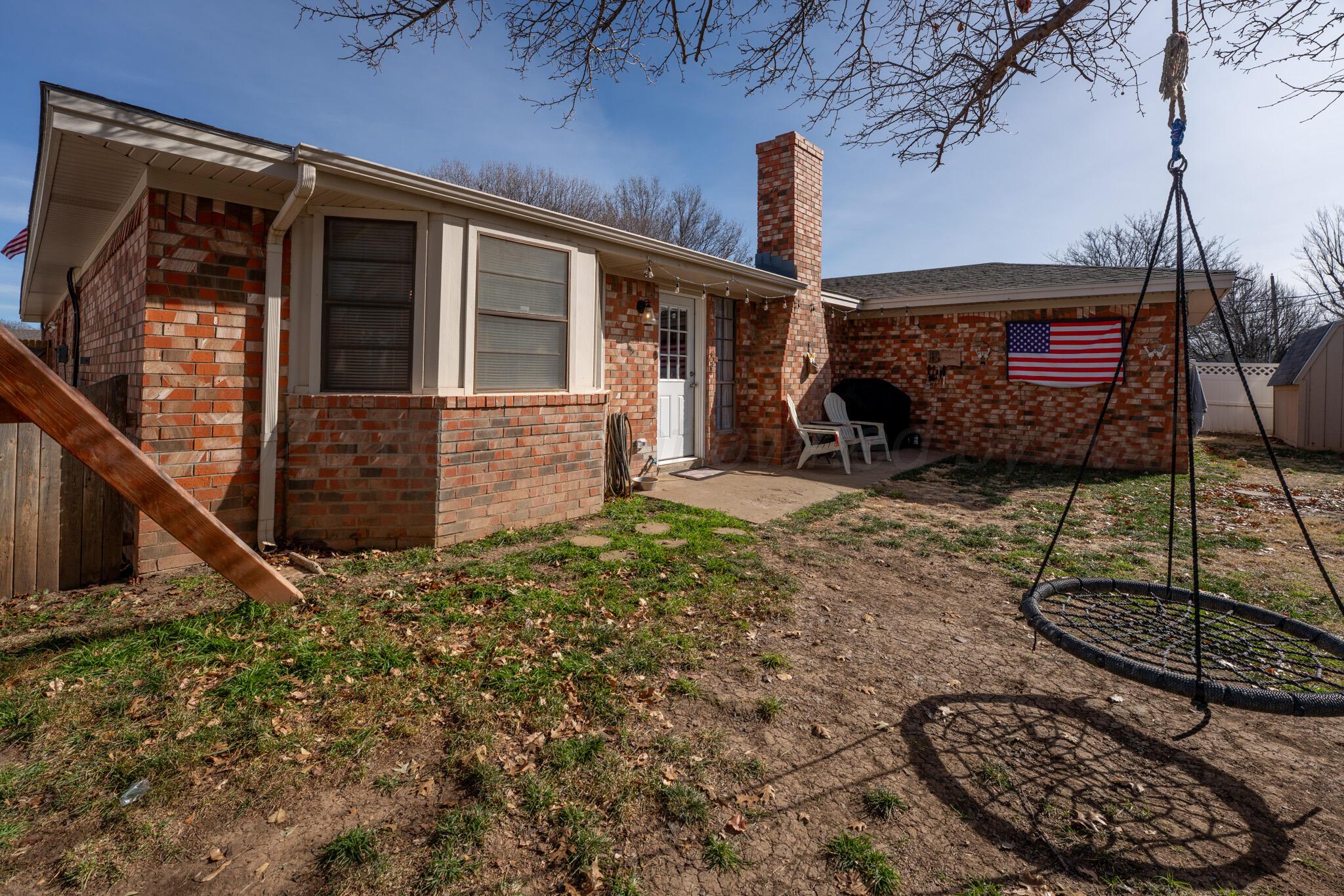 6114 Cornell Street Amarillo, TX 79109 - Photo 31 of 33 a front view of a house with garden