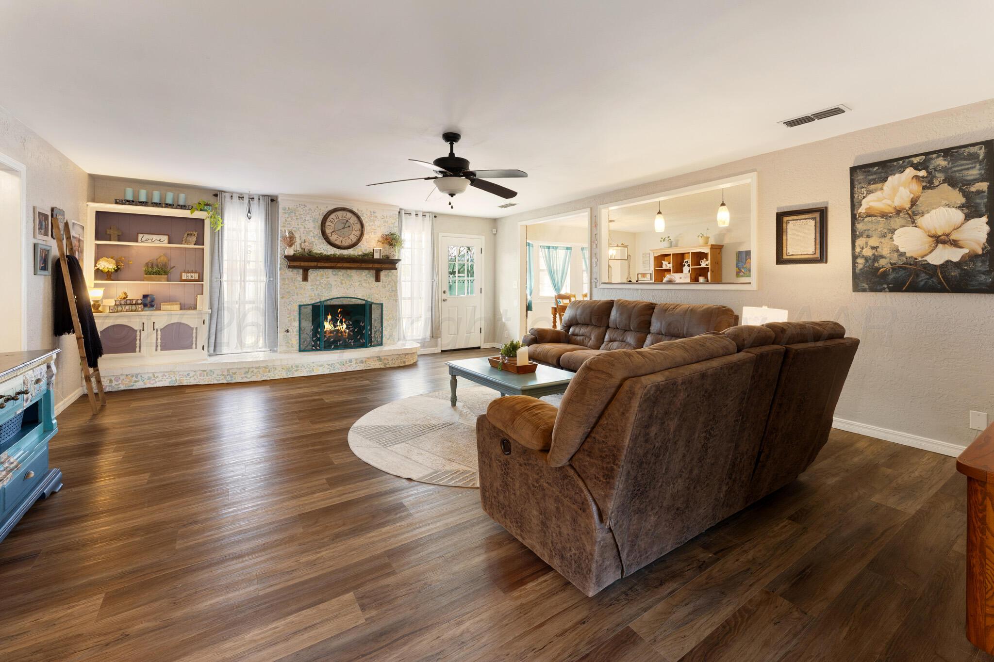 6114 Cornell Street Amarillo, TX 79109 - Photo 5 of 33 a living room with furniture fireplace and wooden floor