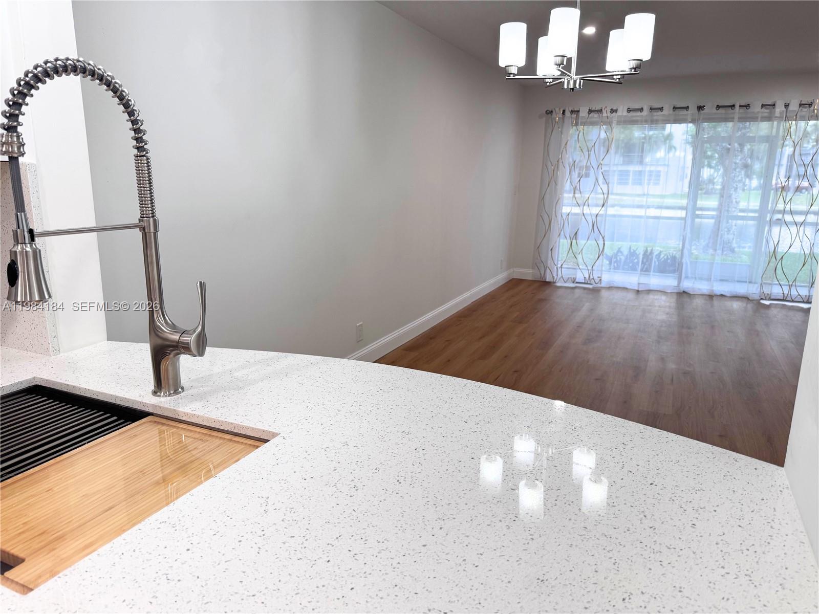 8846 West McNab Road, Unit 106 Tamarac, FL 33321 - Photo 20 of 39 a view of a livingroom with a fireplace