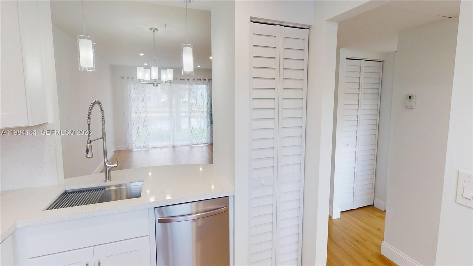 8846 West McNab Road, Unit 106 Tamarac, FL 33321 - Photo 22 of 39 a bathroom with a double vanity sink and a shower