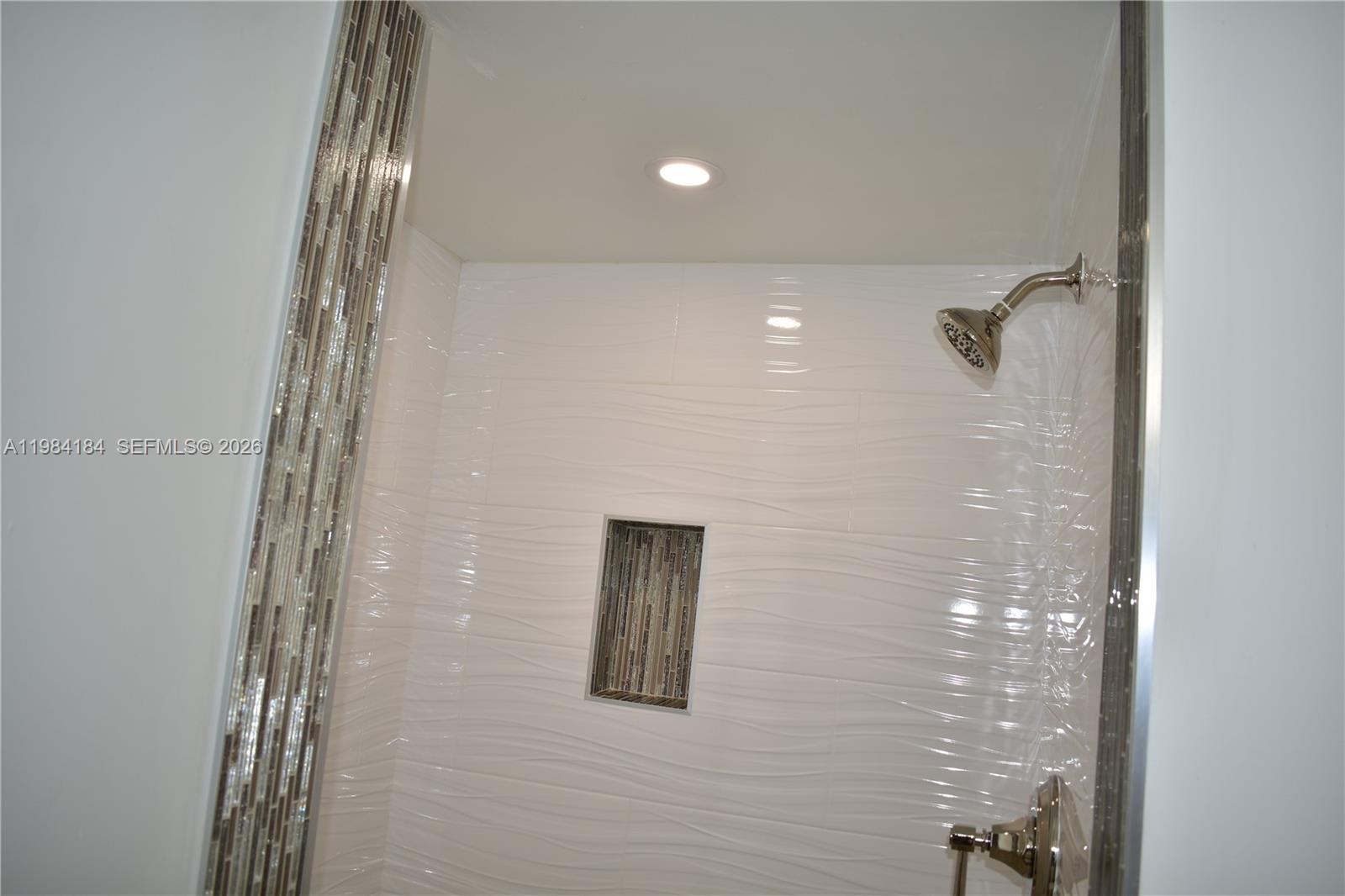 8846 West McNab Road, Unit 106 Tamarac, FL 33321 - Photo 28 of 39 a bathroom with a shower