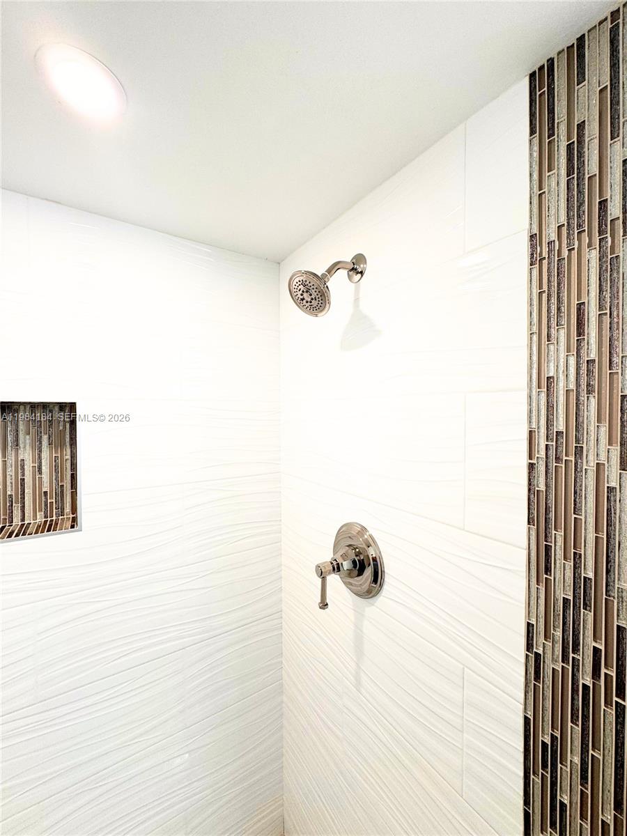 8846 West McNab Road, Unit 106 Tamarac, FL 33321 - Photo 30 of 39 a bathroom with a shower